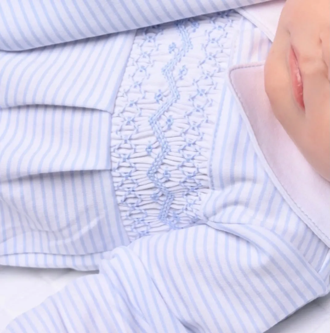 Baby boys magnolia Smocked romper blue and white .